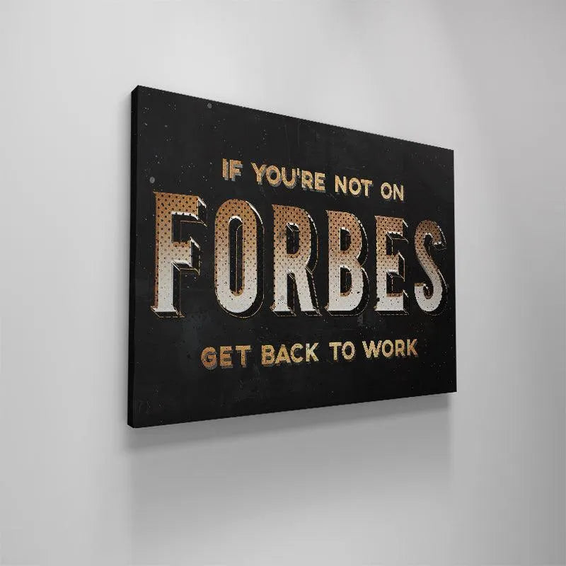Motivational wall décor art on a dark background referencing success and the Forbes List.