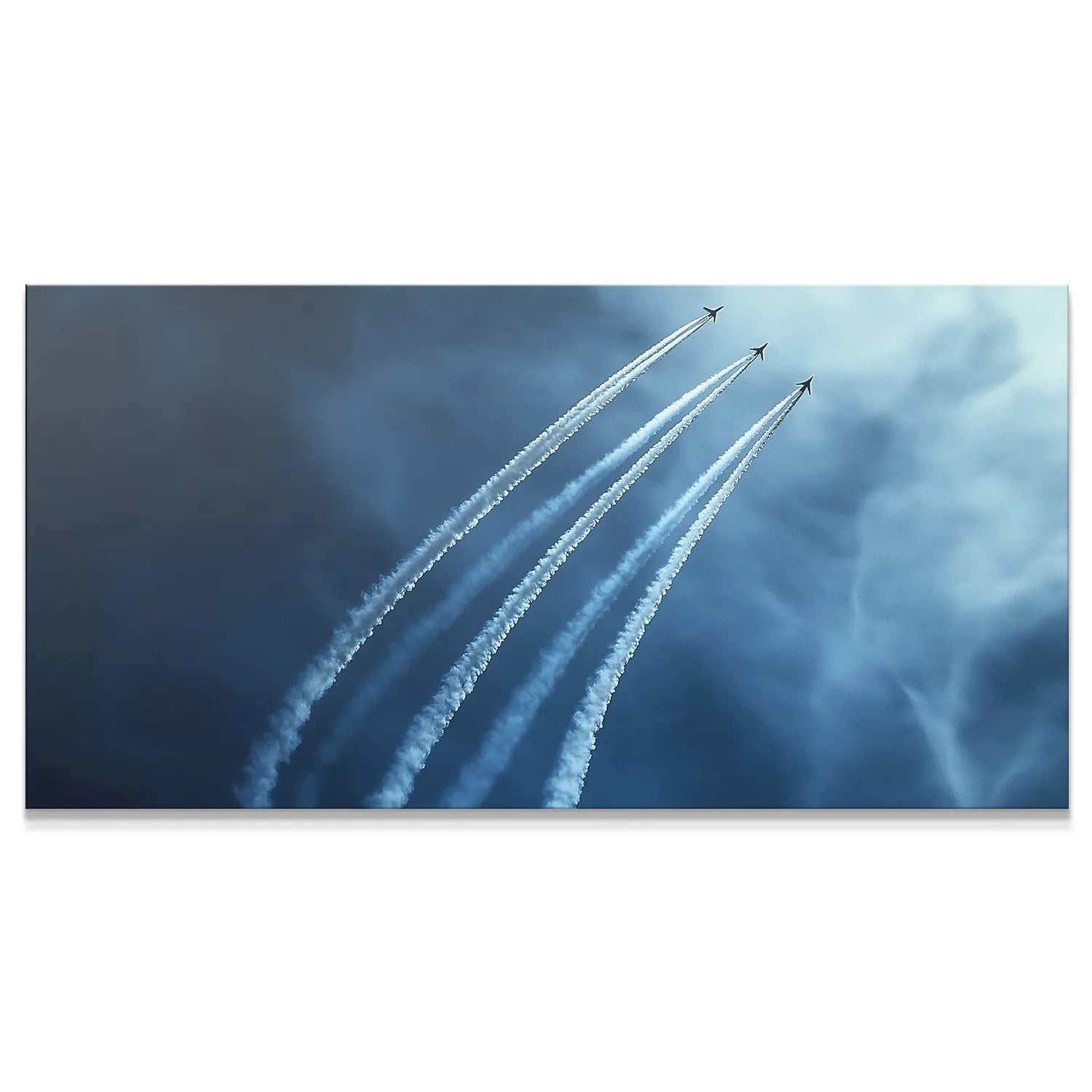 Three fighter jets flying in precise V-shaped Formation against a dark blue sky.