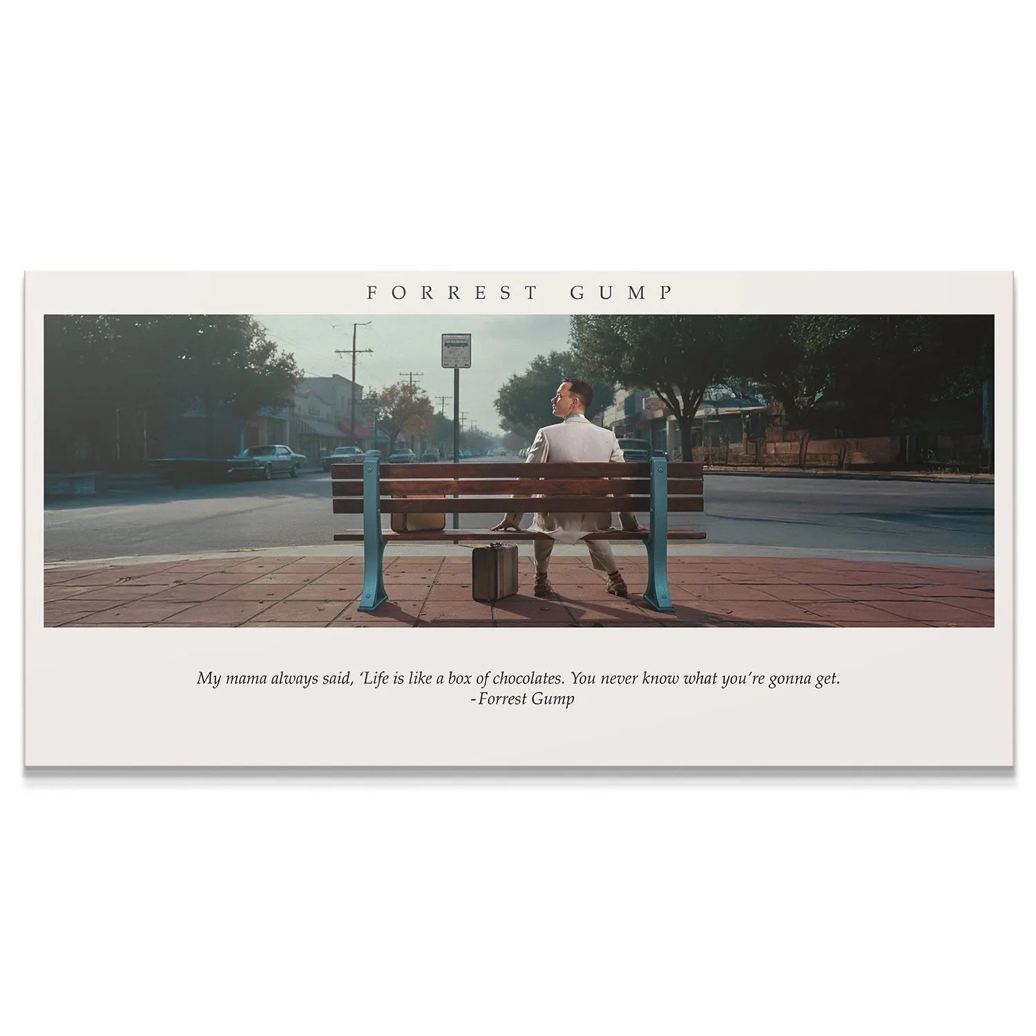 Wide shot of Forrest sitting on the bench, illustrating the full scene of the Forrest Gump - Box of Chocolates poster.