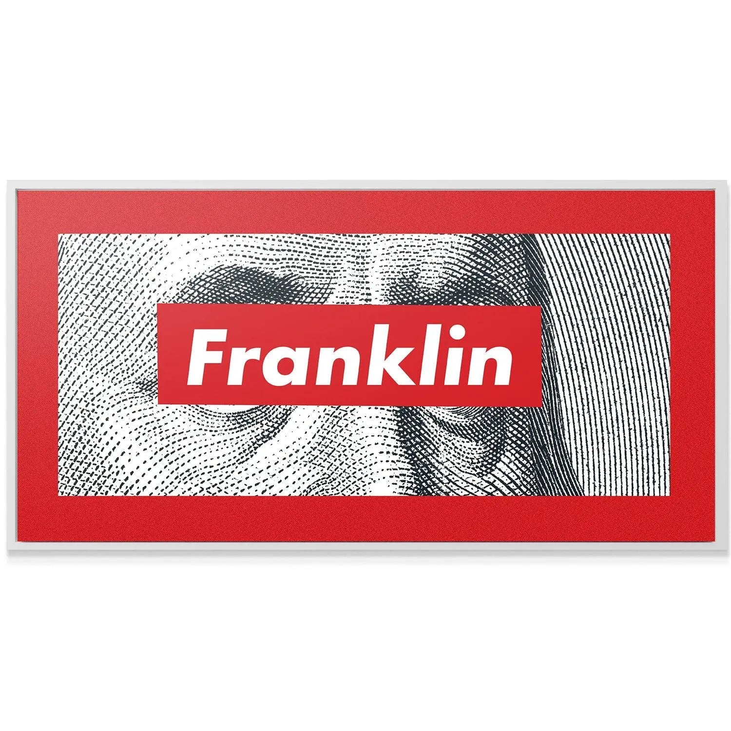 Lifestyle shot of the Franklin box logo print mounted above a modern grey sofa.
