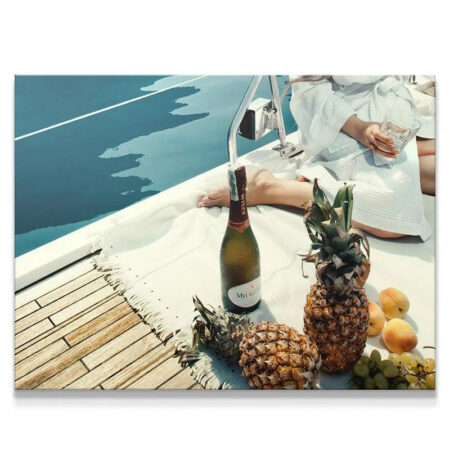 Close-up texture of pineapple and bottle next to the elegant Fruits and Champagne arrangement.