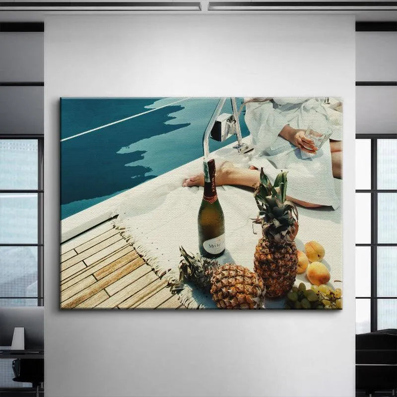 Detail of the sparkling wine bottle and fresh apricots within the Fruits and Champagne setting on a boat.