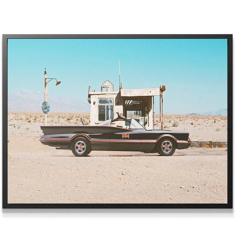 Close-up detail of the custom wheels and red trim of the roadster featured in the 'Gas Stop' photograph.