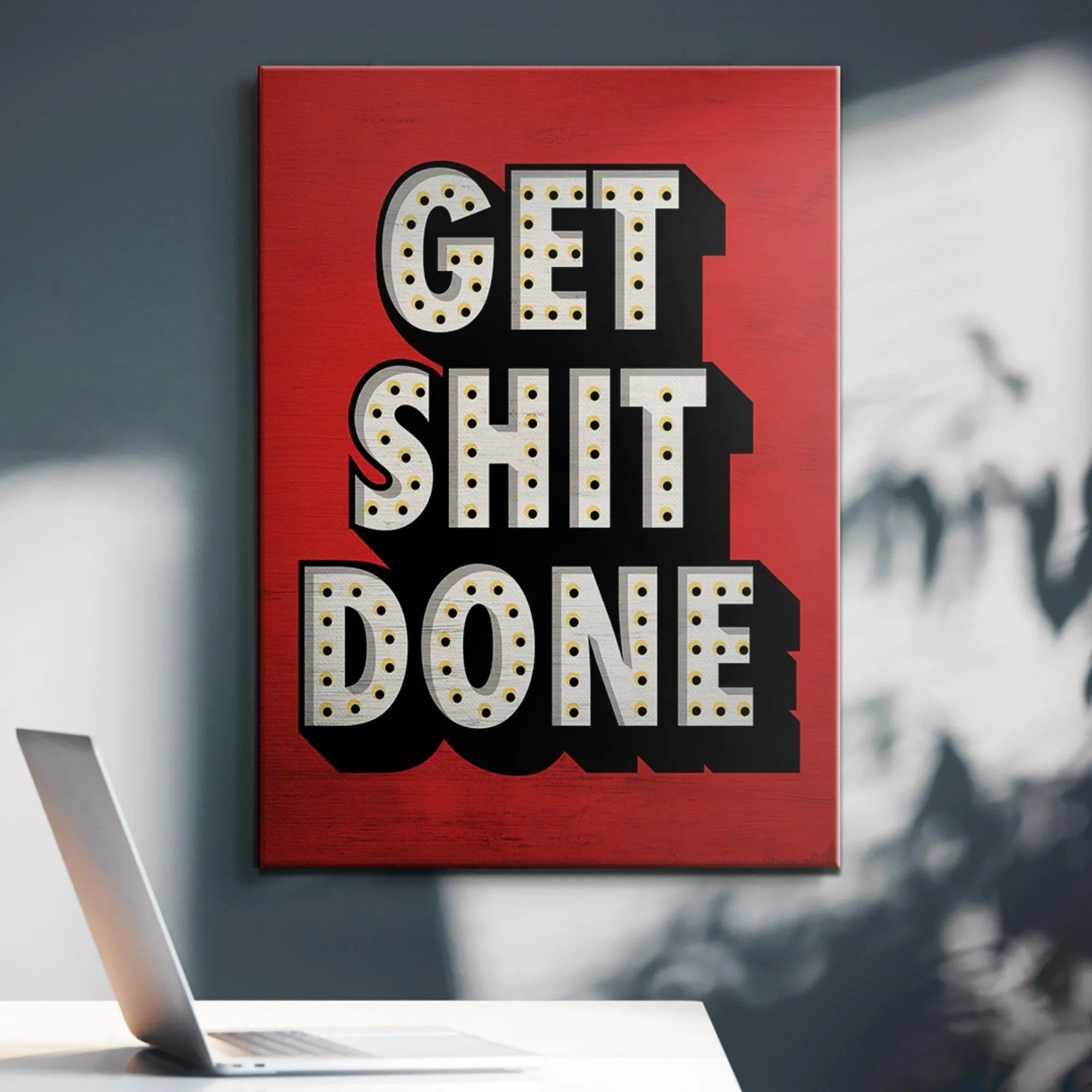 Lifestyle photo: Poster Get Shit Done displayed above a minimalist desk setup for peak motivation.