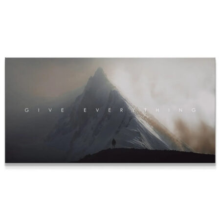 Panoramic view of a snowy mountain peak shrouded in mist with the motivational text 'Give Everything'.