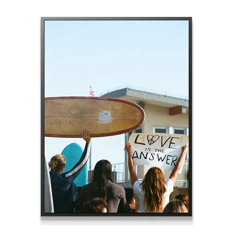 Close-up detail of the 'Love Is The Answer' sign with peace symbol to Give Love.