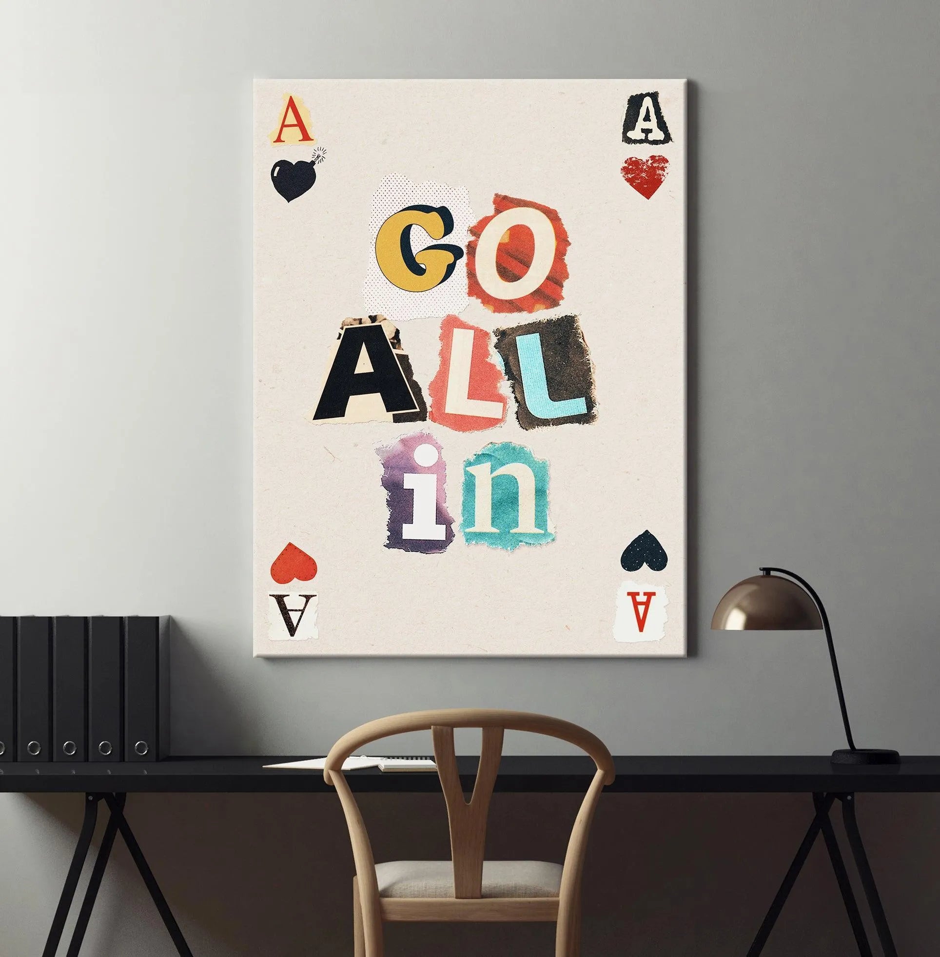 Lifestyle shot of the vibrant "Go All In" poster hanging in a modern home office setting.