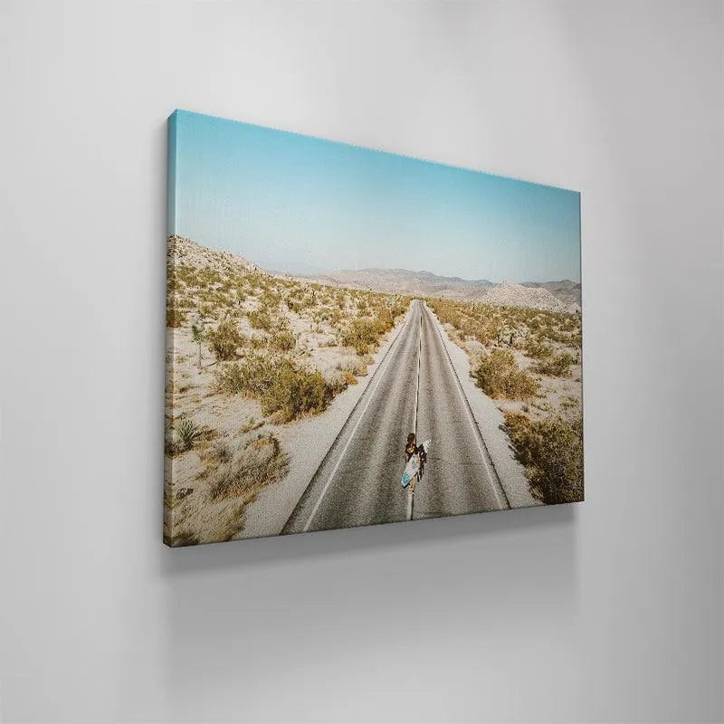 The contrast between the bright white centerline and the dark road texture in the Going Places artwork.