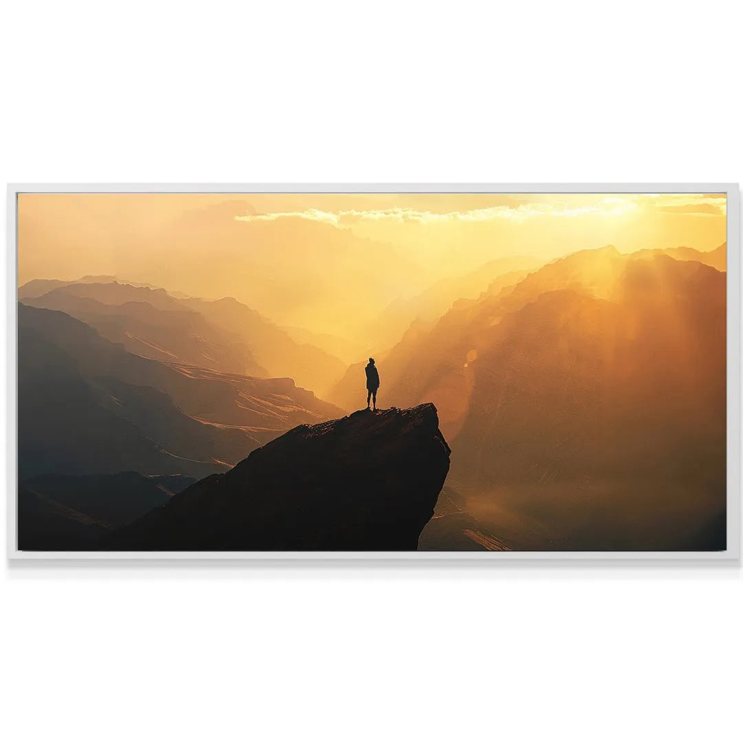 Lone figure standing triumphant on the peak of the majestic Golden Cliff artwork.