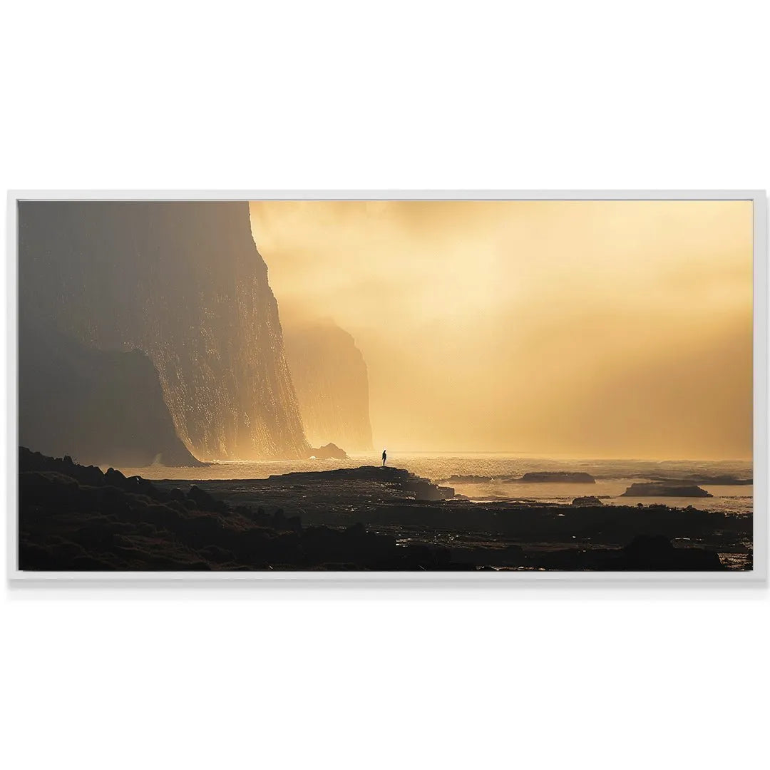 Horizontal view of the dark, rugged foreground rocks leading into the misty sea of the Golden Coast artwork.
