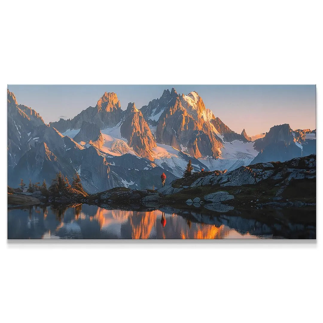 Wide panoramic view of the 'Golden Ridge' mountain range at sunset reflected in water.