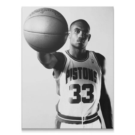 Close-up textural shot of the basketball held by Grant Hill - #2 in Pistons jersey.