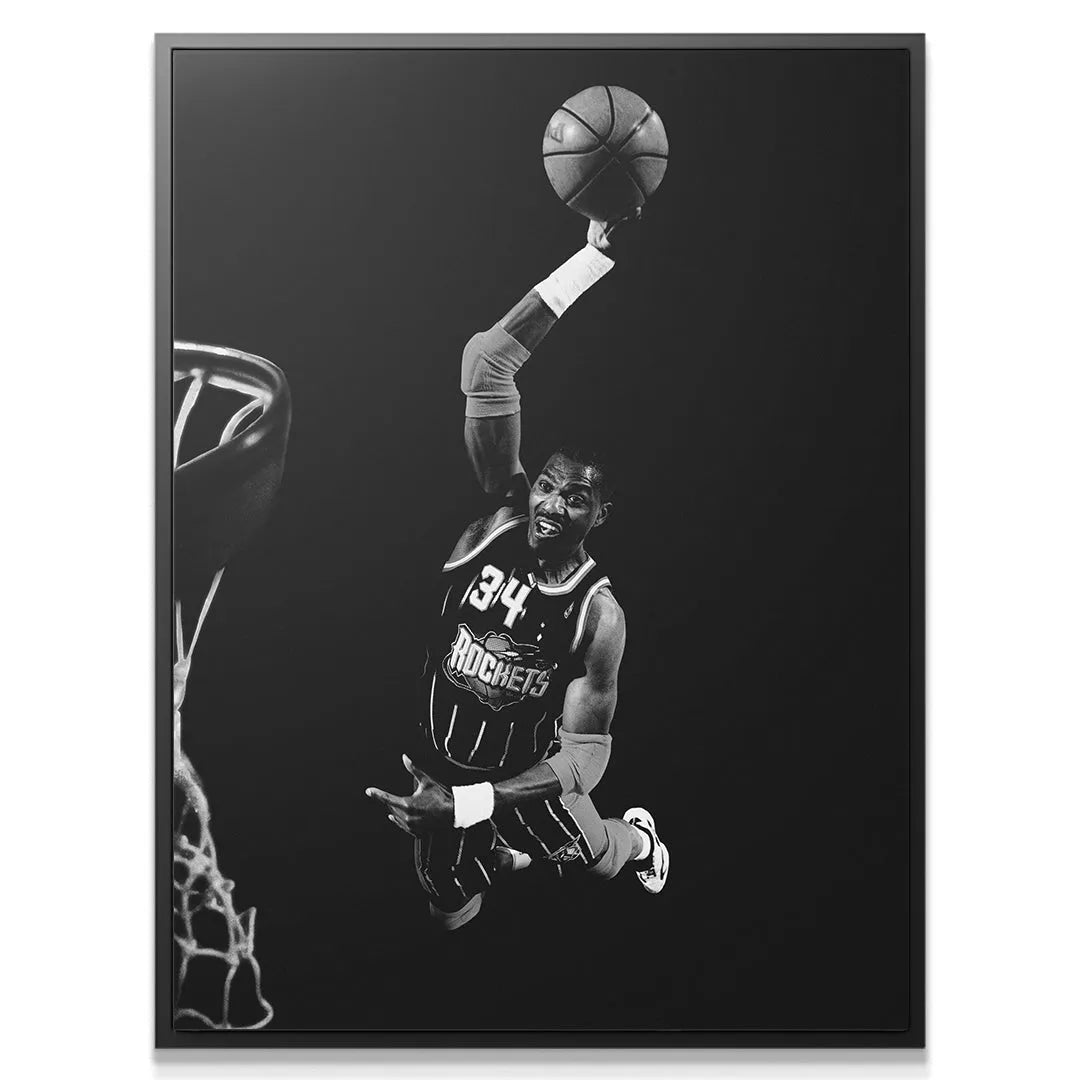 Close-up detail of Hakeem Olajuwon - #1 face showing intense focus and excitement during the drive to the basket.