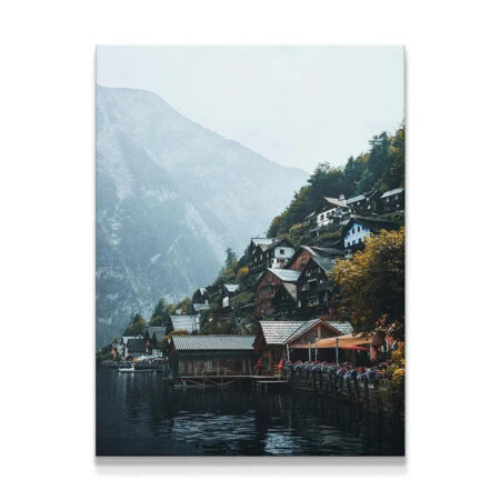 Hallstatt village panoramic view illustrating the steep mountain backdrop and cloudy sky.