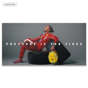 Hamilton – Pressure Is for Tires Wall Art Full horizontal shot of Lewis Hamilton seated calmly on the tire with the statement "Hamilton - Pressure Is for Tires".