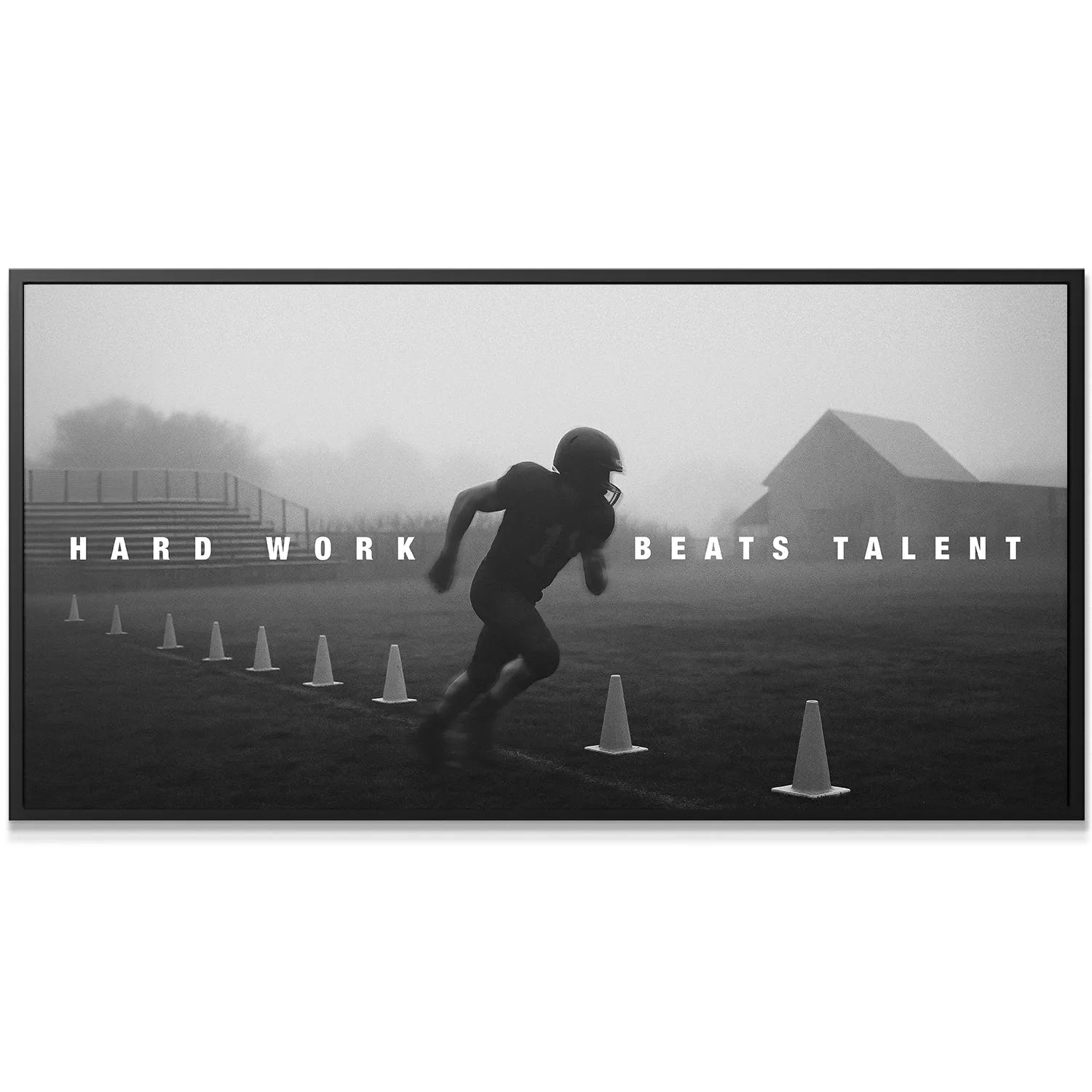 Close-up of a running football player during foggy cone drills shouting "Hard Work Beats Talent".