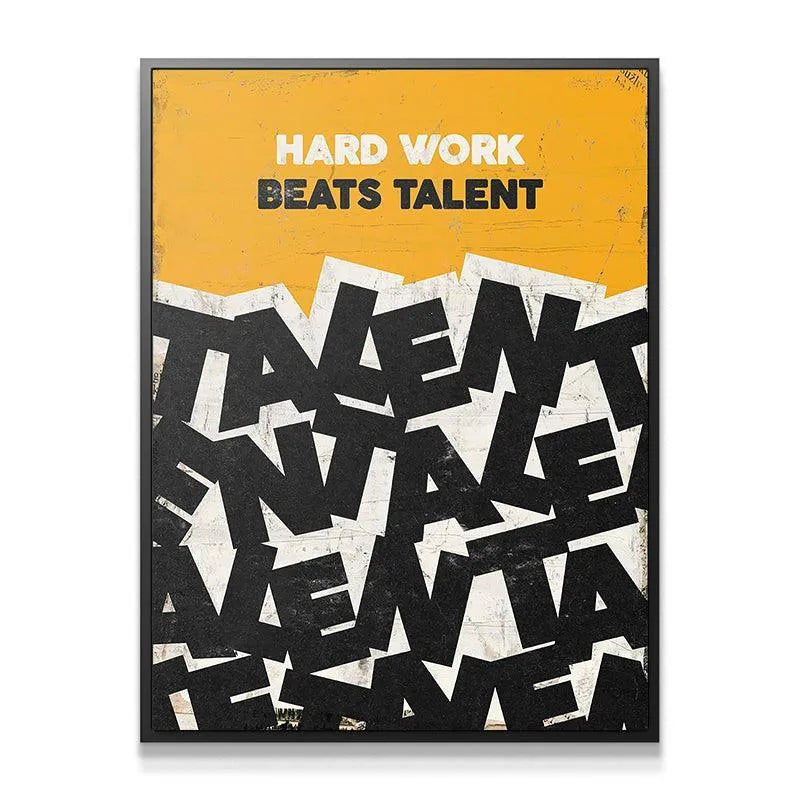 Inspirational canvas art showing the phrase Hard Work Beats Talent mounted on a sleek white modern office wall.