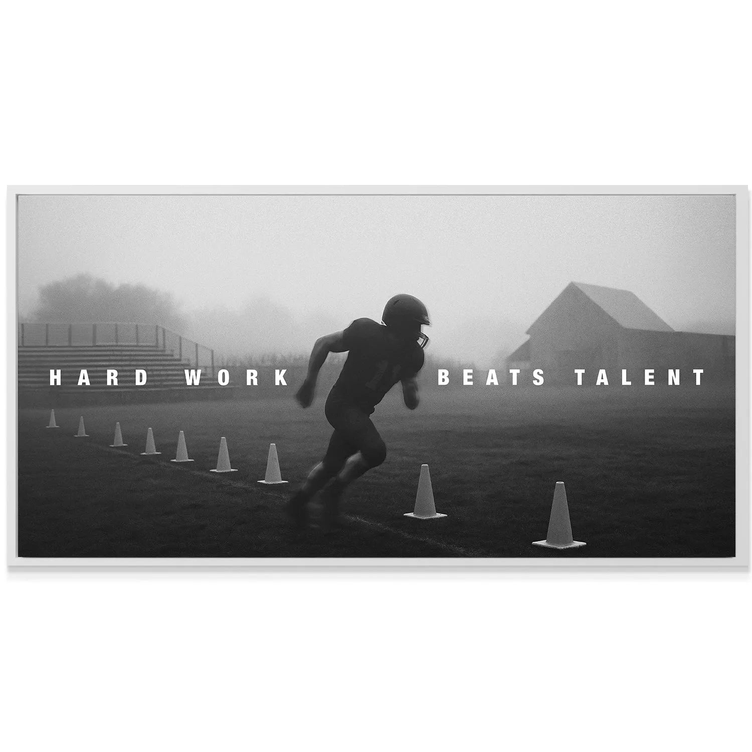 Wide-angle view of foggy stadium background with the bold mantra "Hard Work Beats Talent".