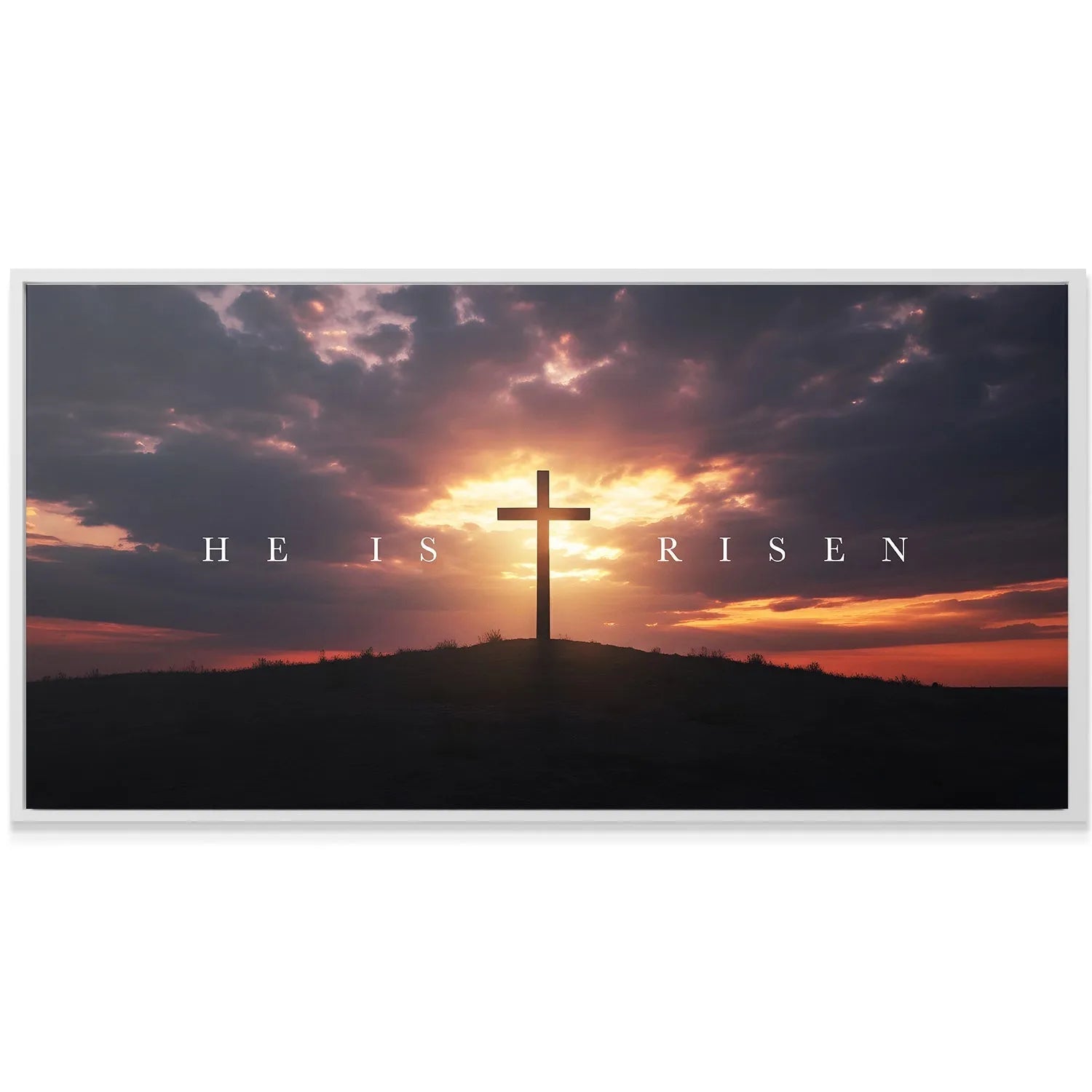Lifestyle mock-up of the 'He Is Risen – Cross' hanging above a fireplace mantle in a modern living room.