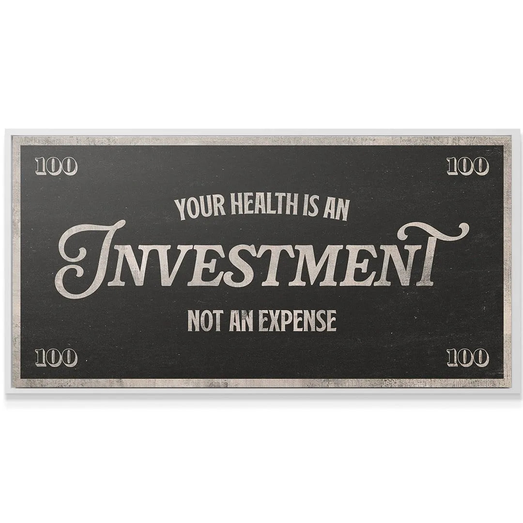 Angled view of the motivational poster hanging in a modern home gym setting, reminding users that Health Is An Investment.