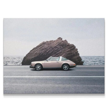 Side view of a vintage pink Targa on a coastal road, illustrating the moment of "Hide and Go Seek."