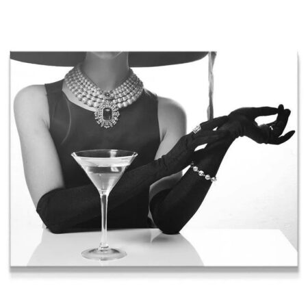 Black and white close-up of the pearl necklace and martini glass at the Hotel Bar scene.