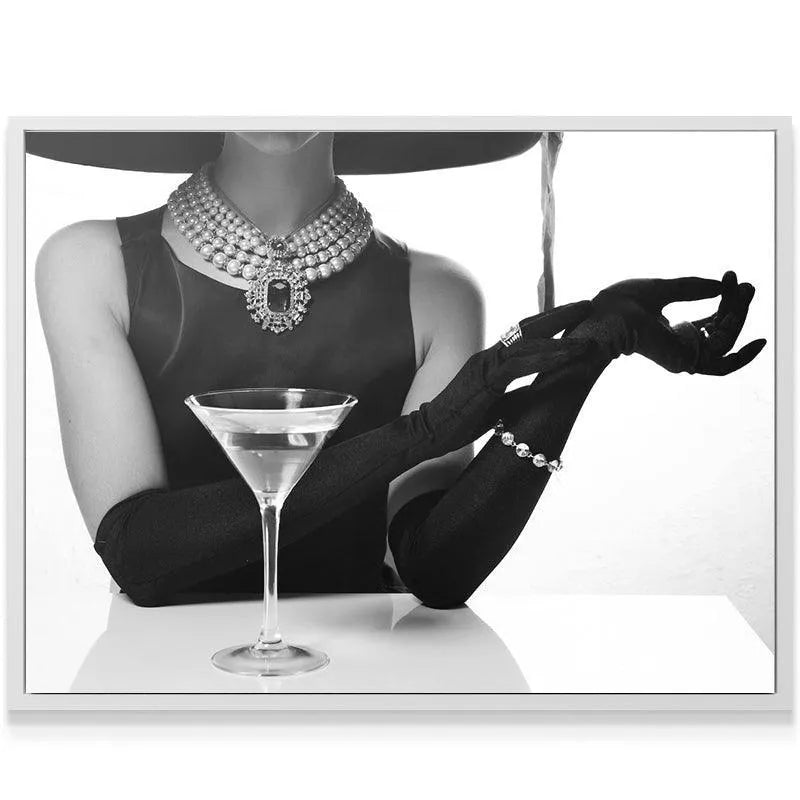 Detailed view of the long black opera gloves and cocktail setting at the Hotel Bar table.