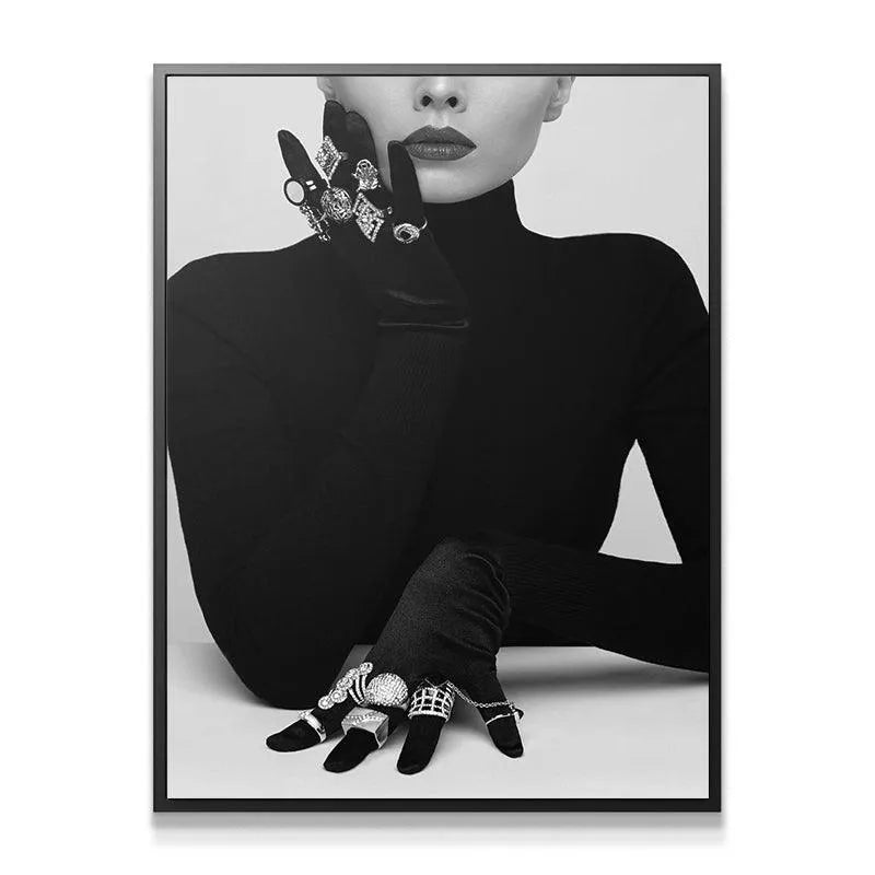 Interesting texture detail of the stacked diamond-look rings on the black velvet glove.