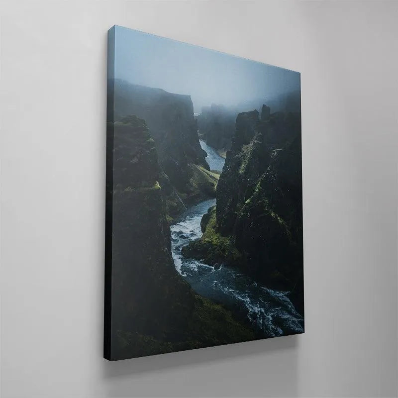 Square crop highlighting the dramatic central flow of the river through the gorge scene from 'Into The Abyss'.