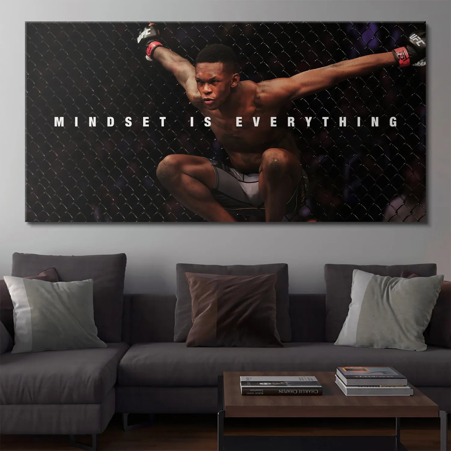 Detail view of the bold white text typography 'MINDSET IS EVERYTHING' below Israel Adesanya in the ring.
