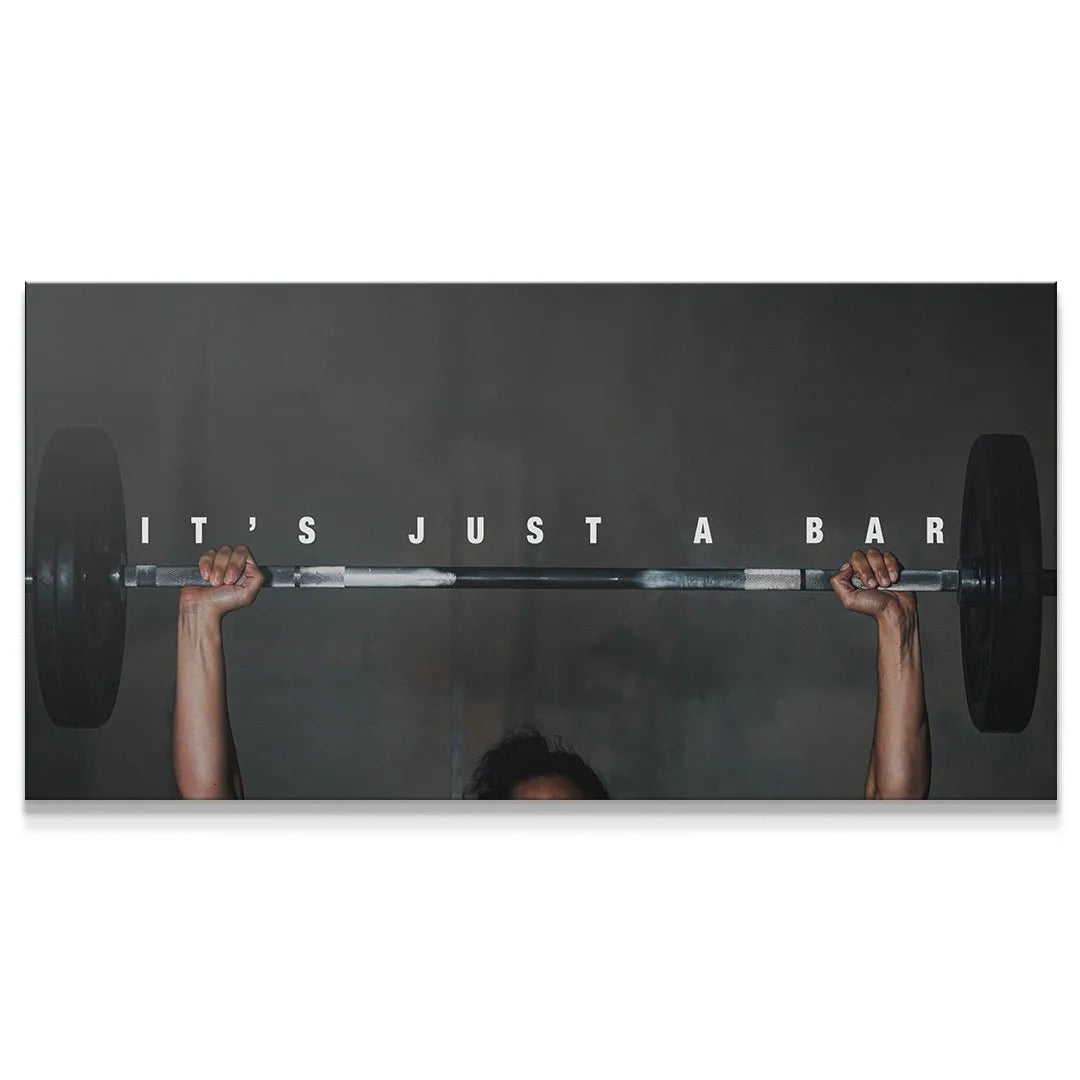 Wide angle motivational canvas art print It's Just A Bar (Woman) featuring an intense overhead weightlifting lock-out.