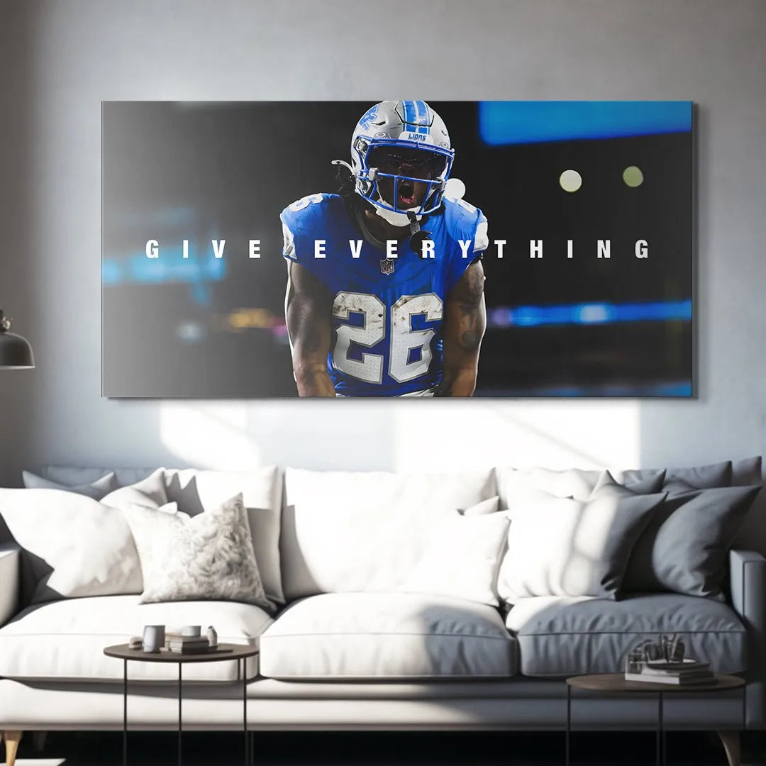 Side angle shot of the mounted motivational art featuring Jahmyr Gibbs - Give Everything on a dark wall background.