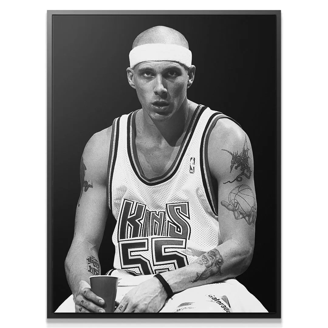 Black and white print detail of Jason Williams - #2 resting on the bench with a red cup.