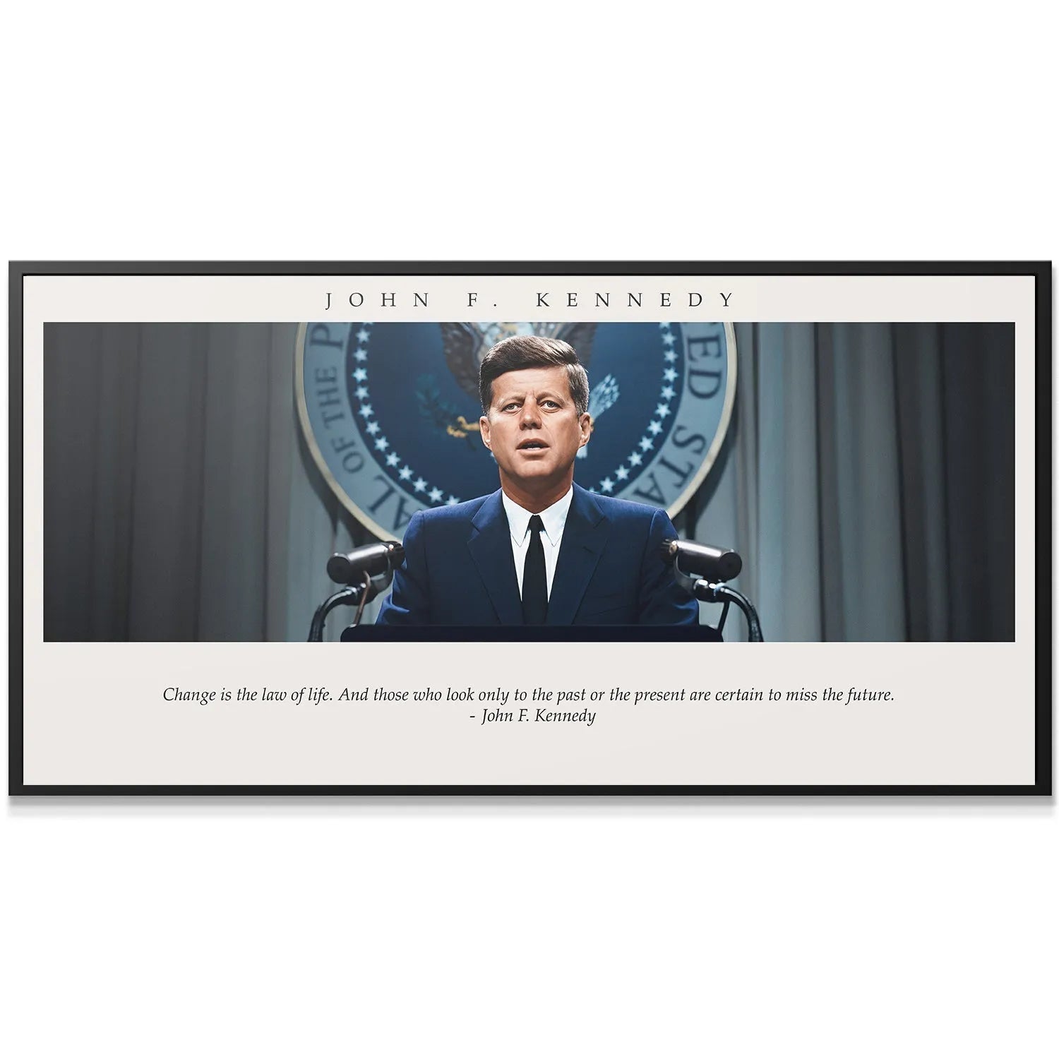 Wide horizontal view of the historical presidential podium setup with the quote 'JFK - Change is the Law of Life'.