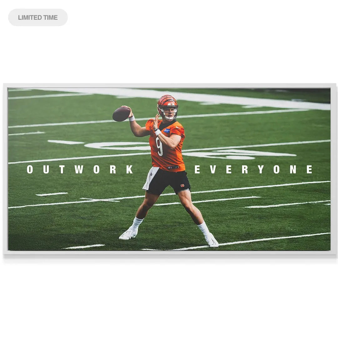 Motivational wall art angle of the Joe Burrow - Outwork Everyone design displayed proudly in a modern living room setting.