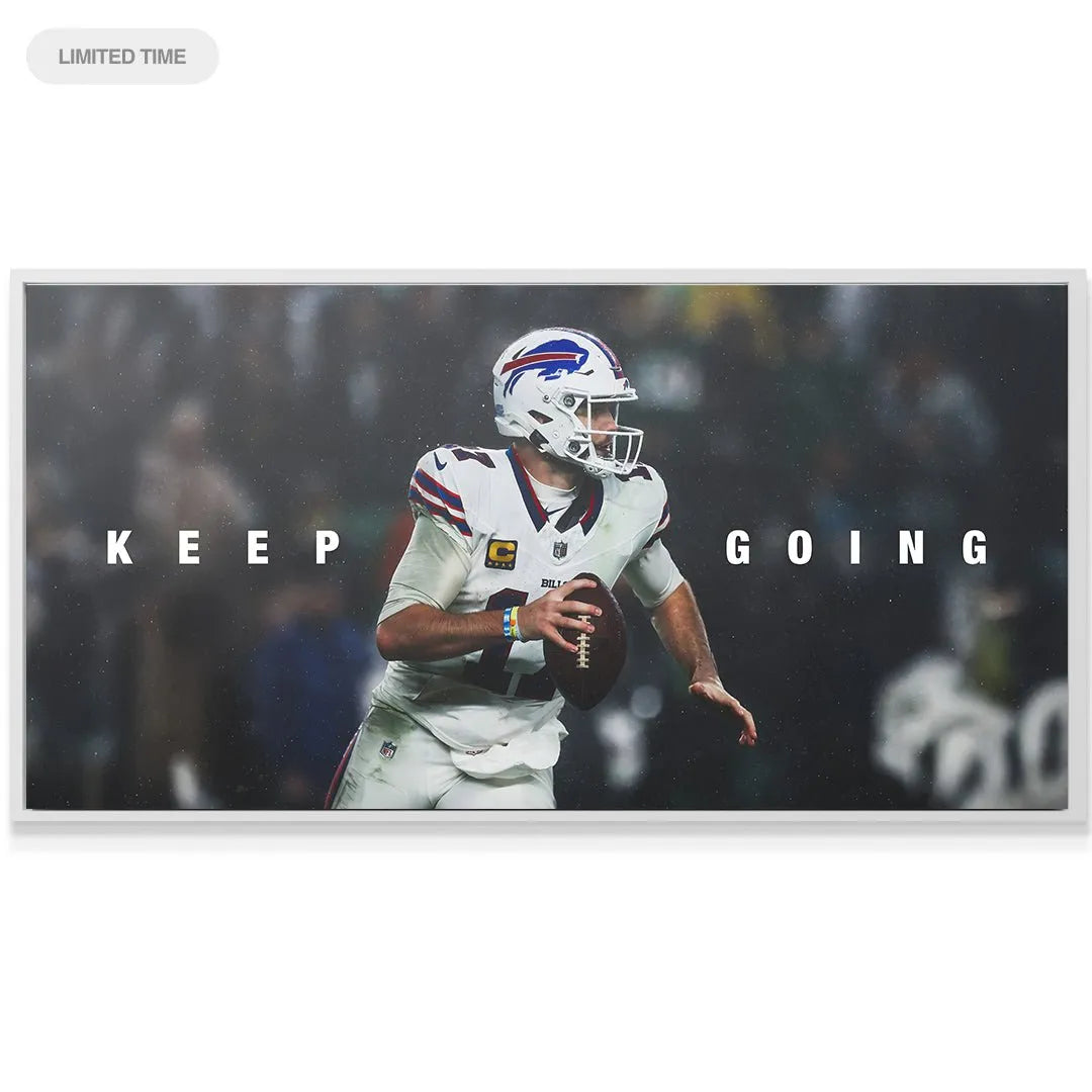 Lifestyle shot of the framed 'Josh Allen - Keep Going' poster displayed above an office desk as motivational décor.