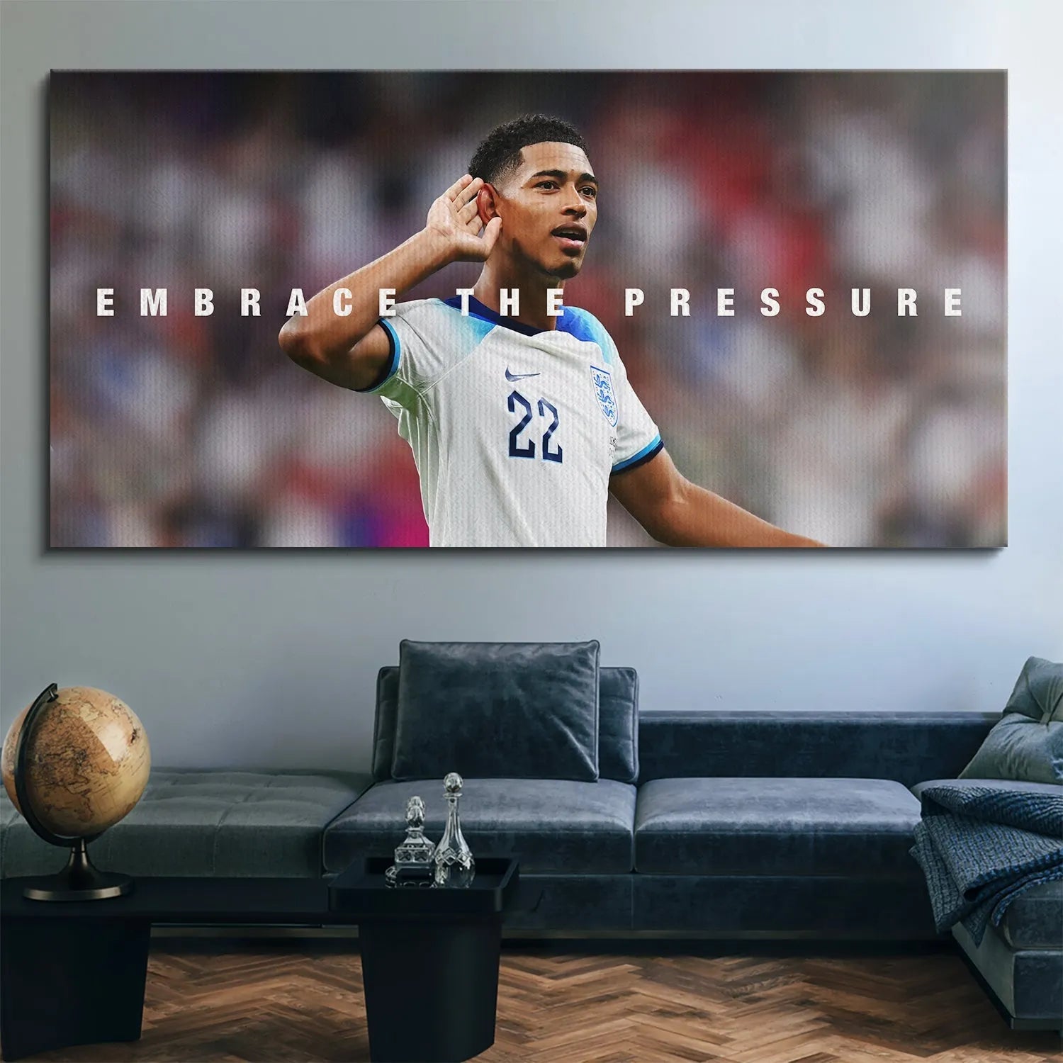 Lifestyle image of the framed 'Jude Bellingham - Embrace The Pressure' print displayed prominently in a modern living room setting.