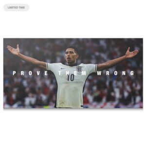 Jude Bellingham – Prove Them Wrong #2 Wall Art Triumphant wide shot of Jude Bellingham - Prove Them Wrong #2 celebrating with arms outstretched on the pitch.