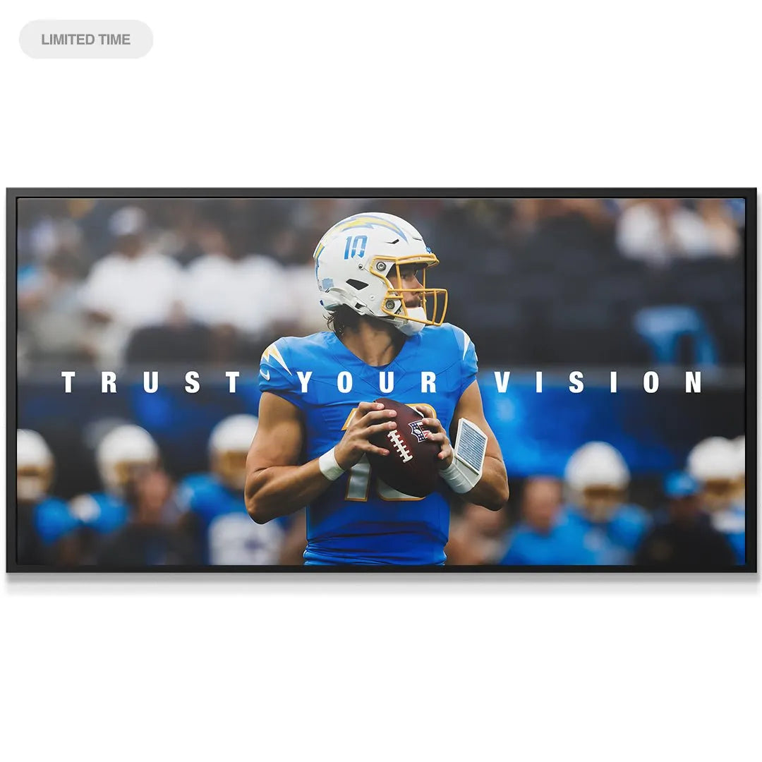 Wide shot of the framed 'Justin Herbert - Trust Your Vision' artwork depicting the stadium background blur.