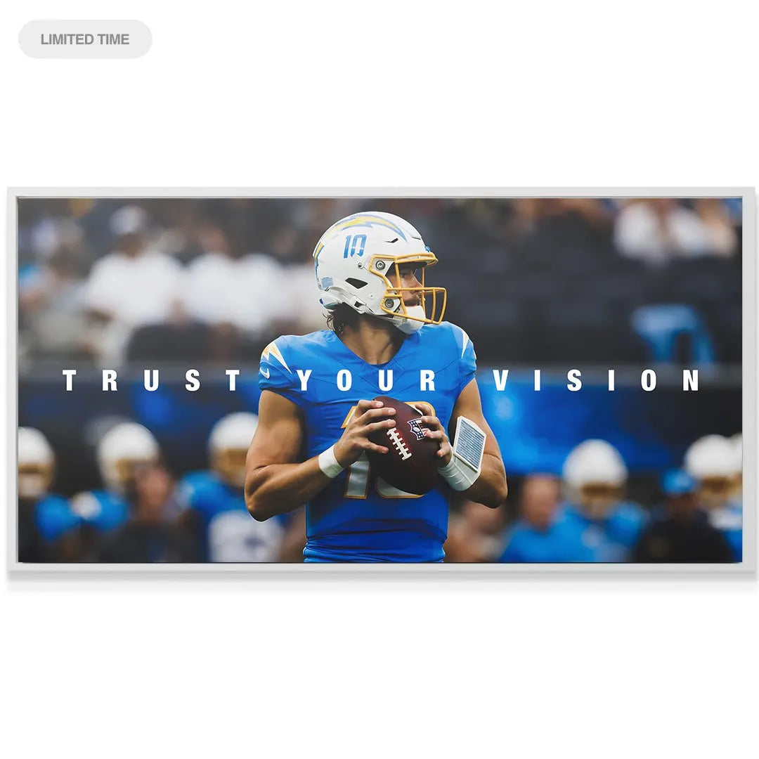 Lifestyle image showing the 'Justin Herbert - Trust Your Vision' print displayed above a sleek office desk.