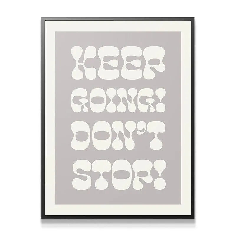Close-up texture shot showing the smooth matte paper finish of the 'Keep Going! Don't Stop!' art print.