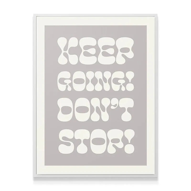 Angled shot of the framed print, highlighting the thin light border surrounding "Keep Going! Don't Stop!".