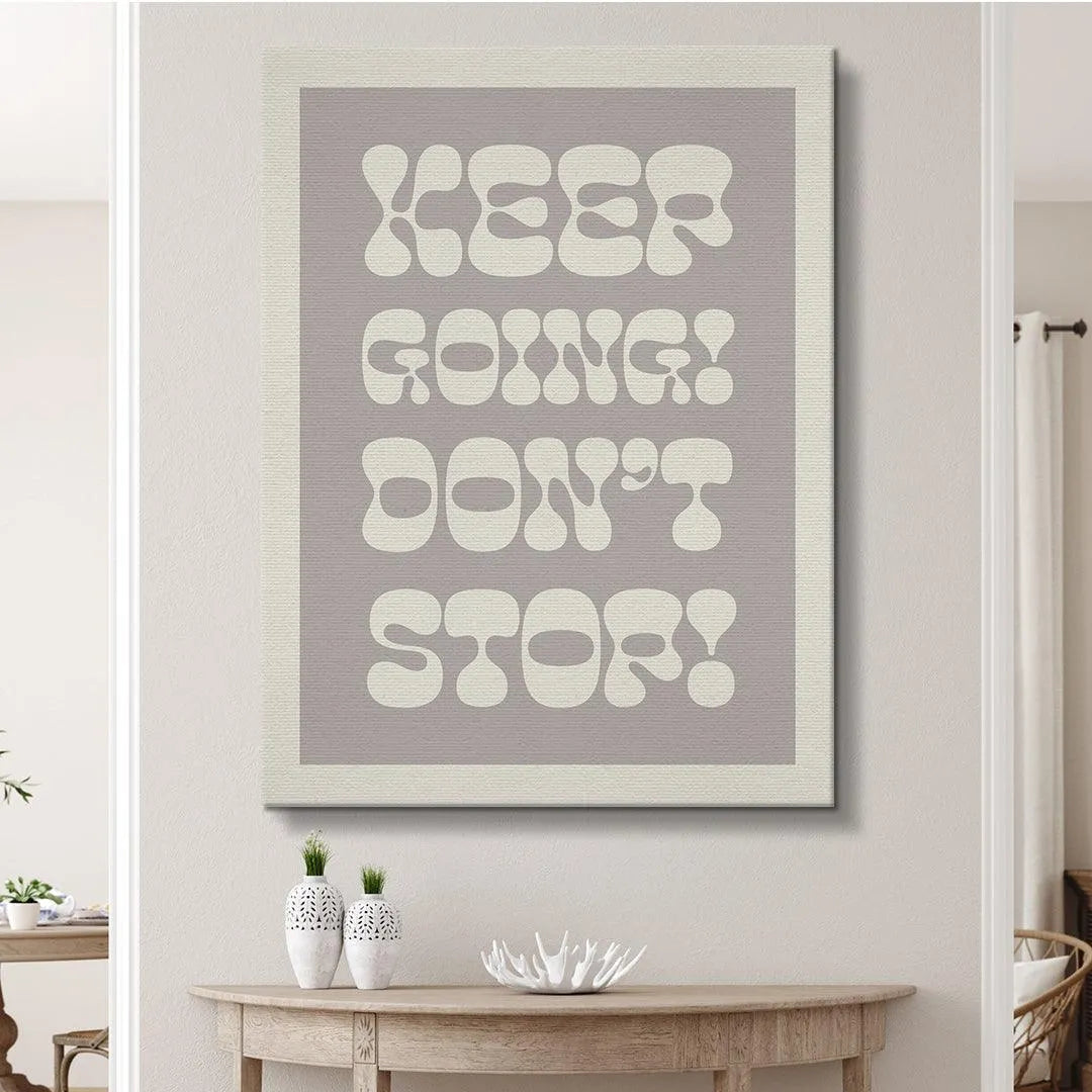 Detail focusing on the unique, rounded letterforms used for the bold phrase "Keep Going! Don't Stop!".
