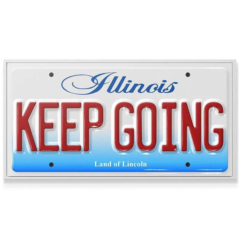 Angle shot highlighting the blue script "Illinois" header detail on the Keep Going - IL plate replica.