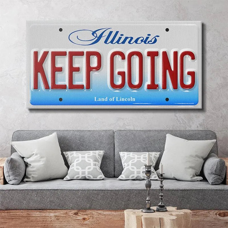 Lifestyle image showing the Keep Going - IL novelty plate mounted on a garage wall decoration setup.