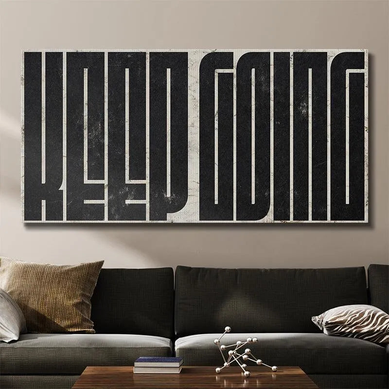 Lifestyle image of 'Keep Going - Maze (Black)' displayed above a clean, modern home office desk setup.