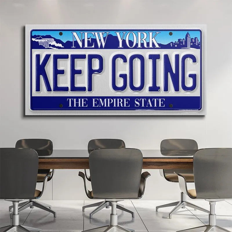 Lifestyle image of the "Keep Going - NY" sign mounted in a rustic garage setting, used as motivational decor.