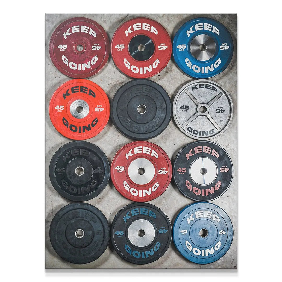 Overhead view of colorful bumper weights art, 'Keep Going Plates' prominently displayed.