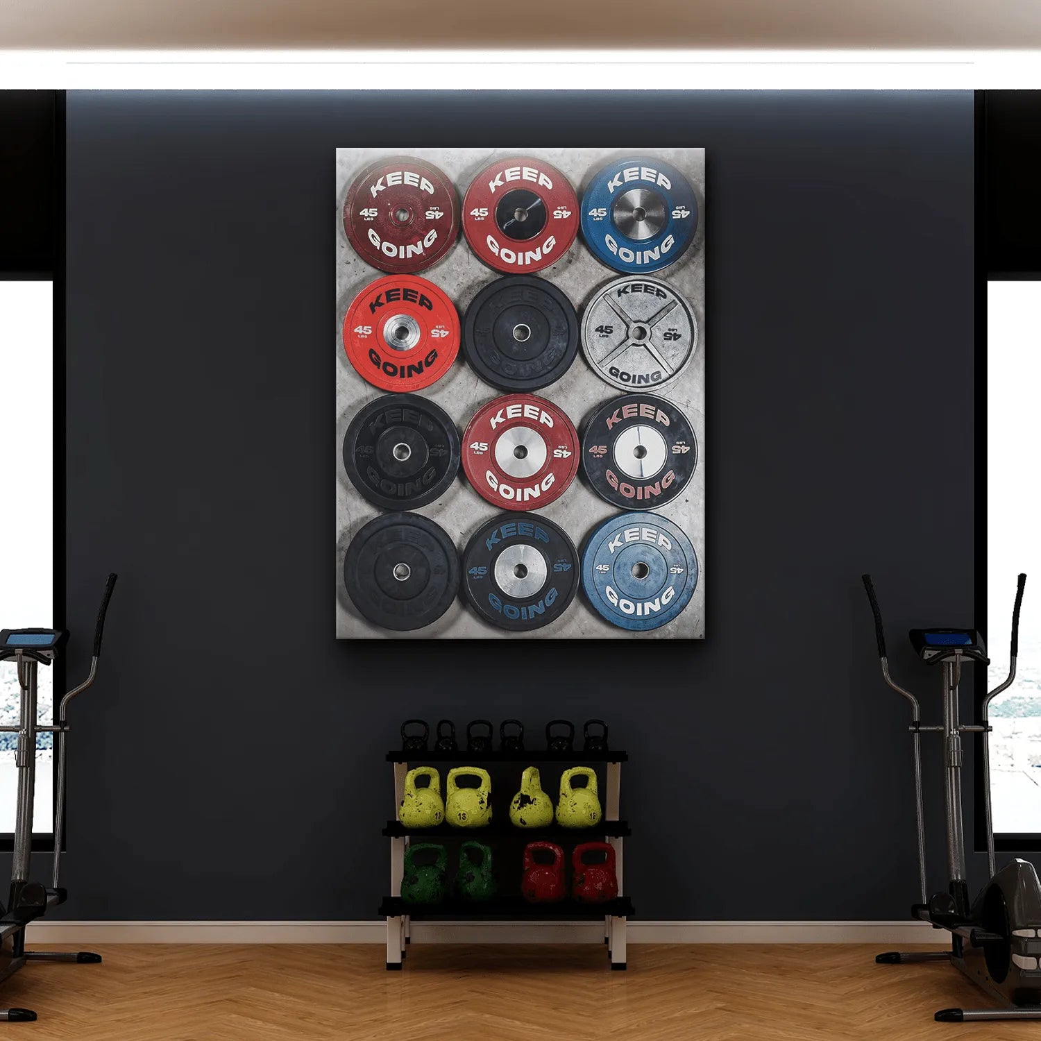 High-angle perspective of blue, red, and silver weight plates featuring 'Keep Going Plates' text.