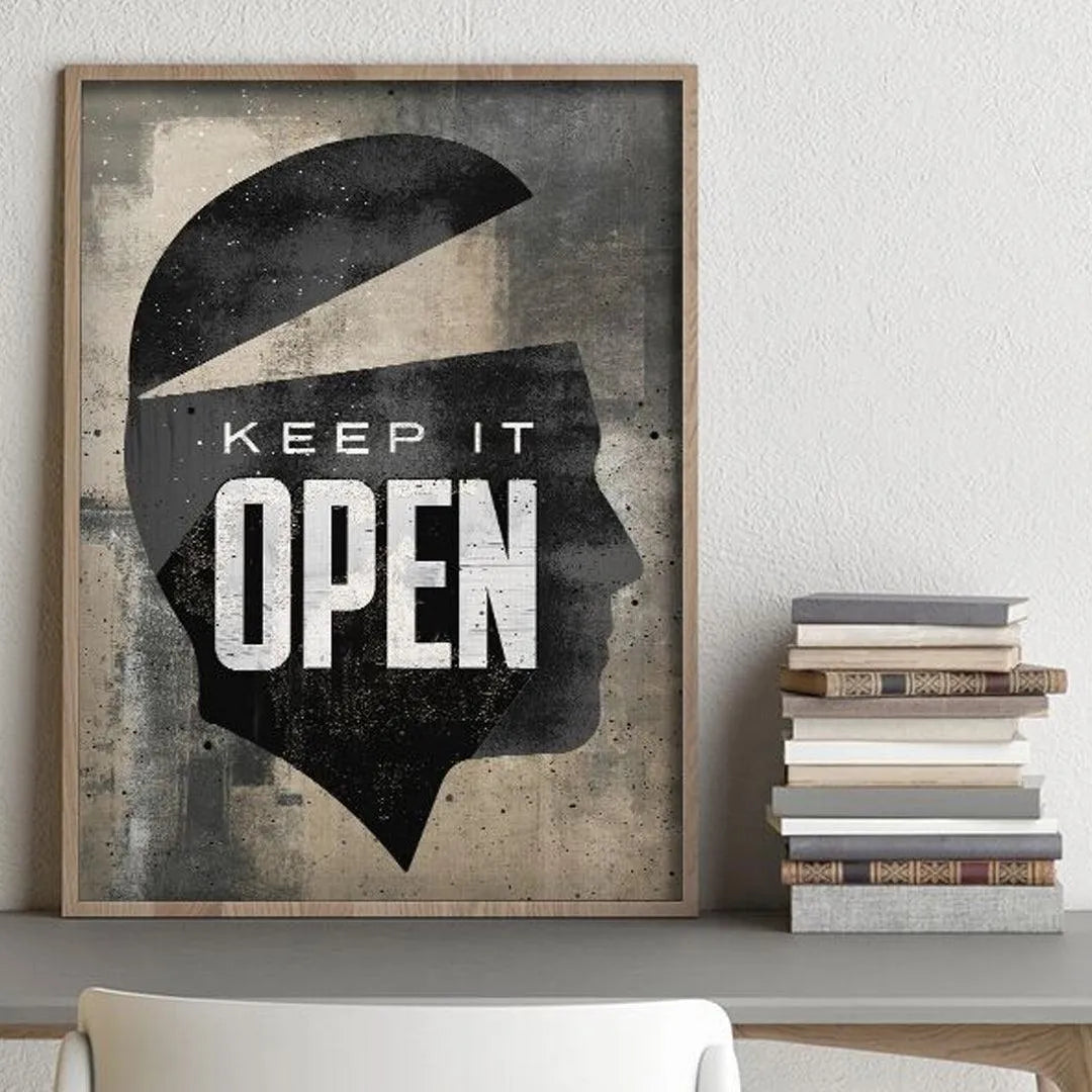 Macro detail focusing on the bold, white typography of 'Keep It Open' contrasting the dark profile.